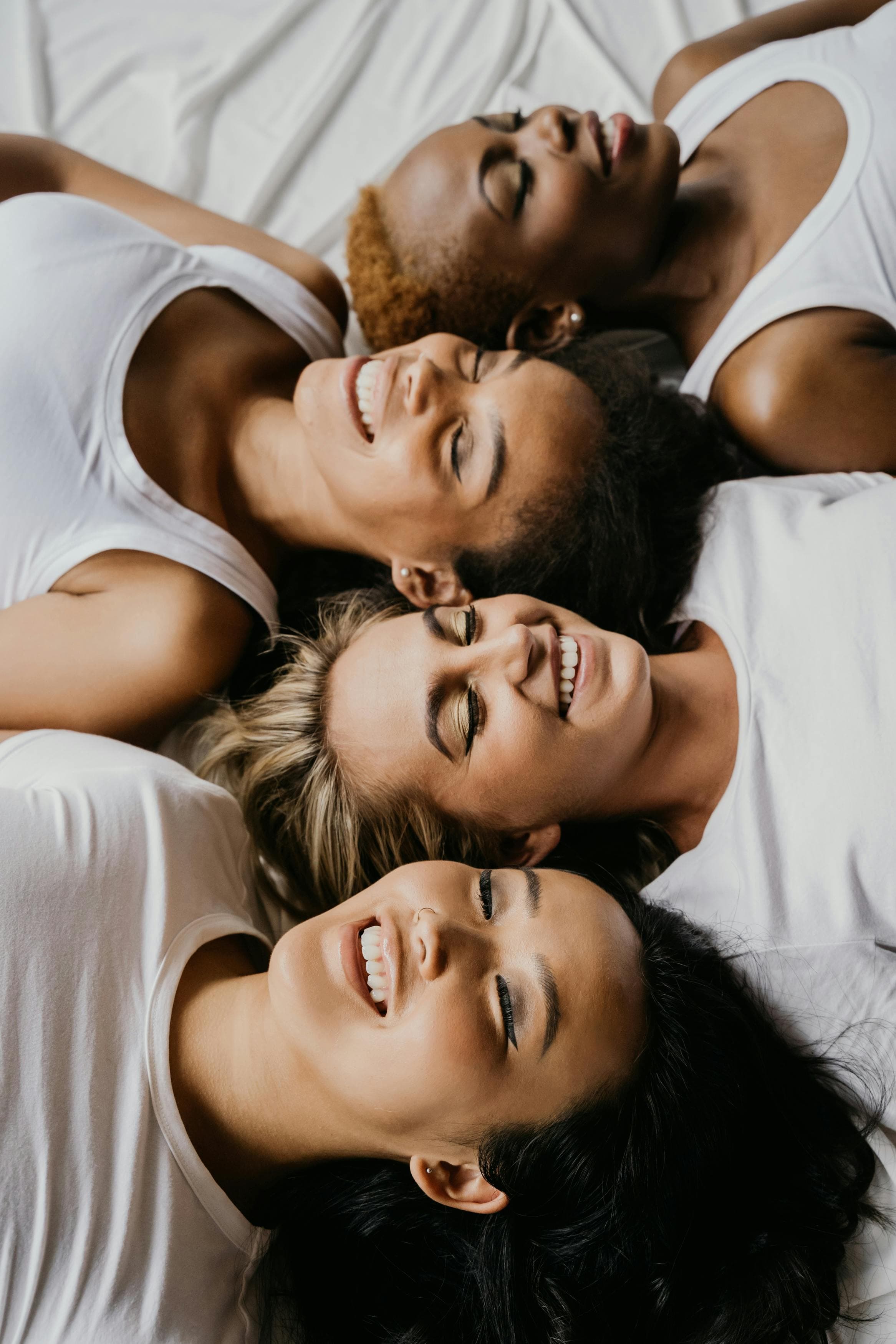 Three people smiling together